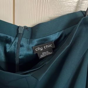 Elegant off shoulder jumper has deep pockets very comfortable.